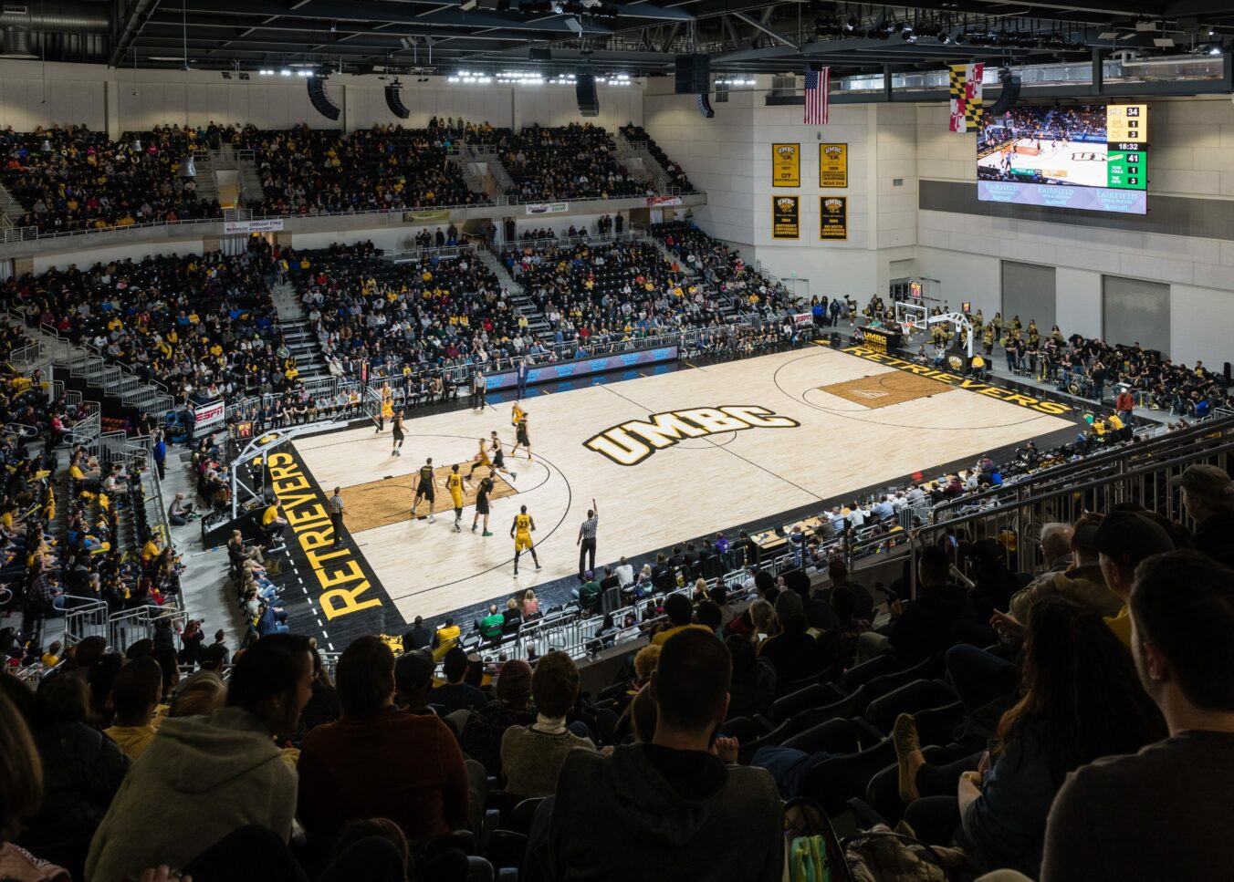 Packed stands cheering on the UMBC Retrievers men's basketball team