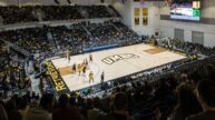 Packed stands cheering on the UMBC Retrievers men's basketball team