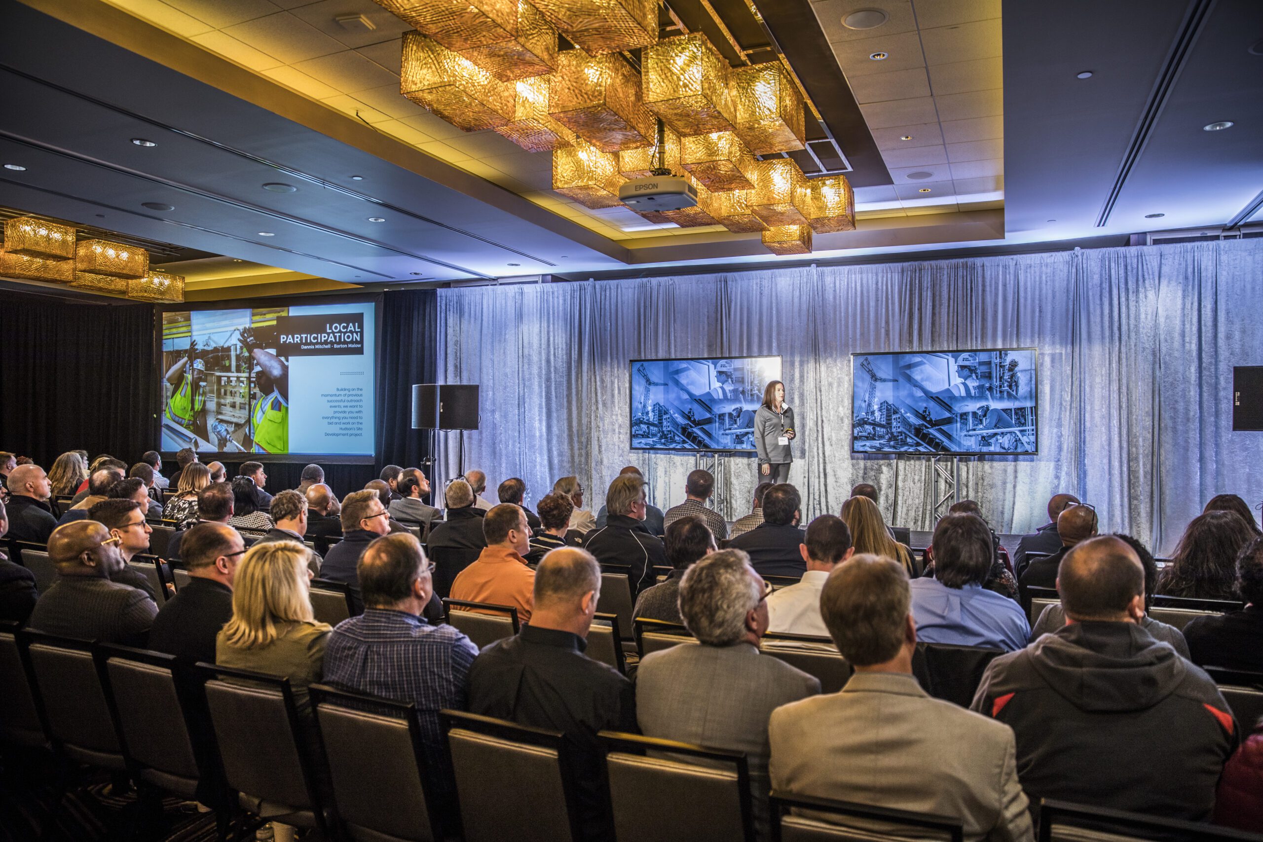 Speaker presenting to conference audience