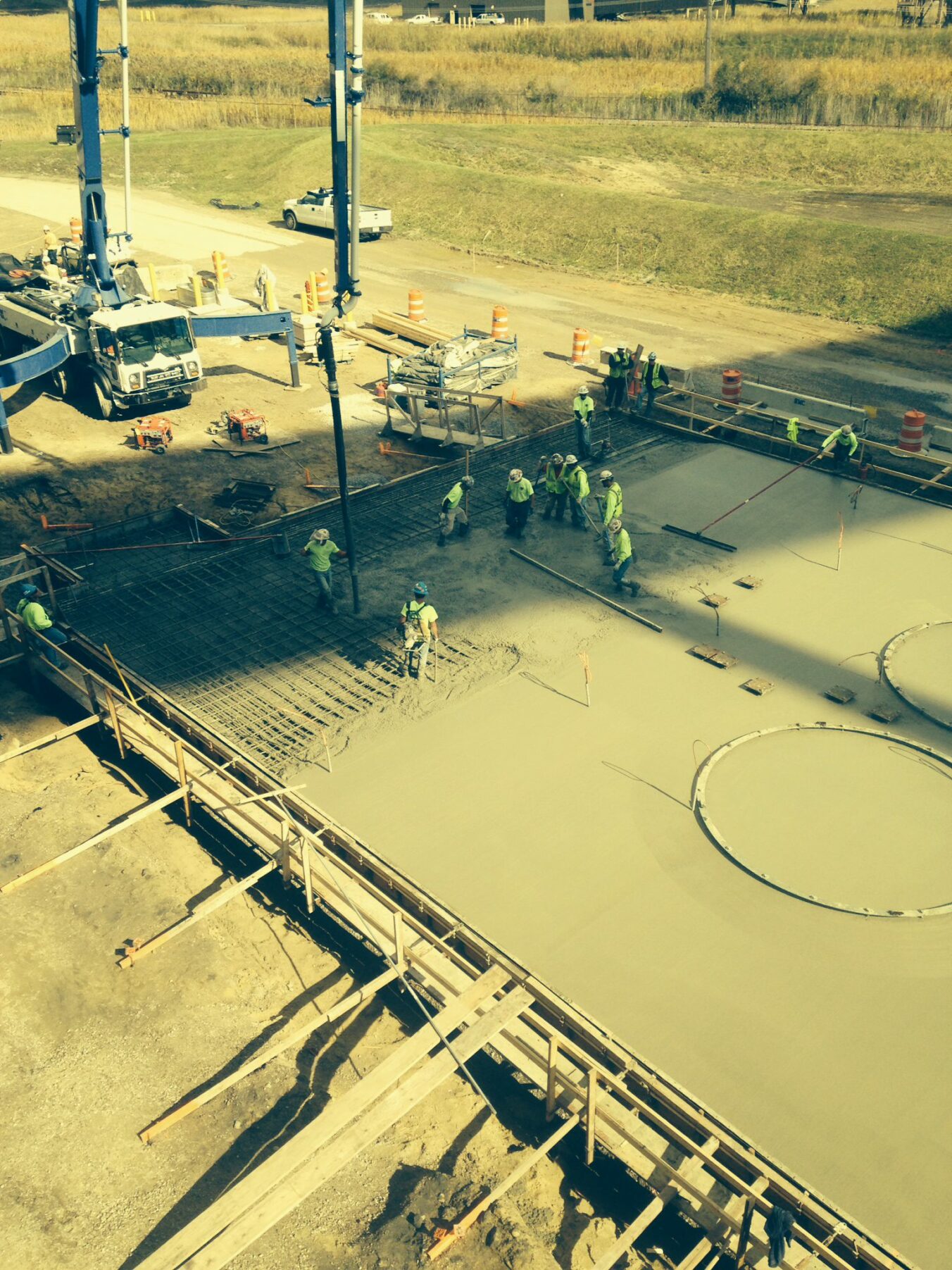 Construction workers pouring concrete at Belle River