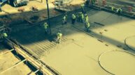 Construction workers pouring concrete at Belle River
