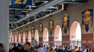 Michigan football fans entering section 27 from interior concourse