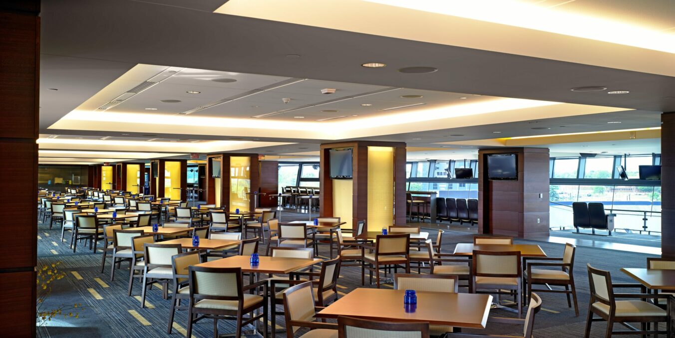 Dining tables and seats in interior concourse club area