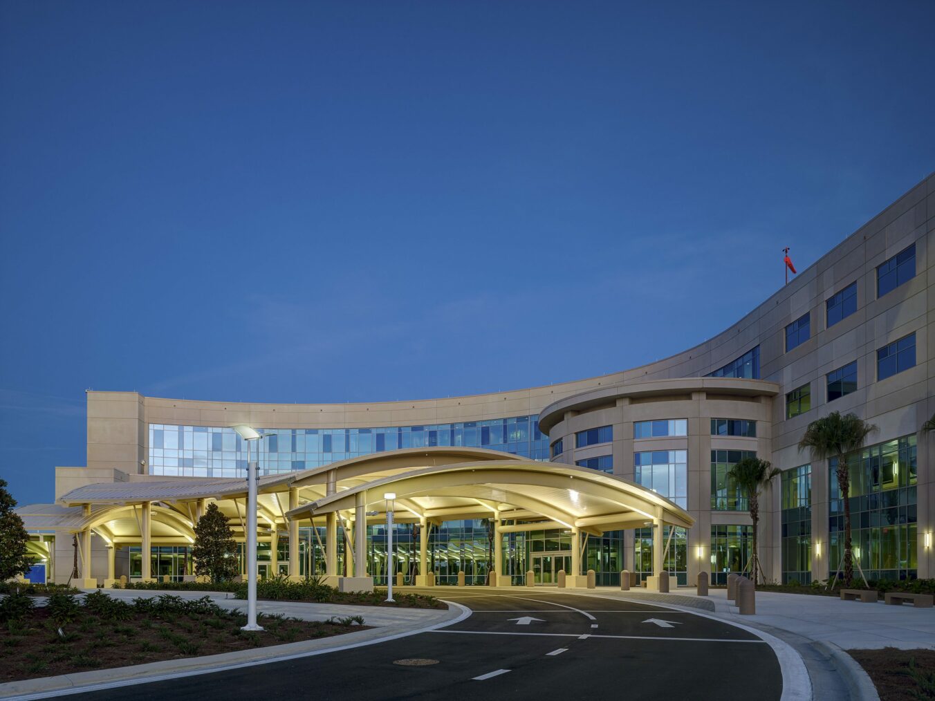Exterior view of hospital's main entrance at night