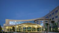 Exterior view of hospital's main entrance at night