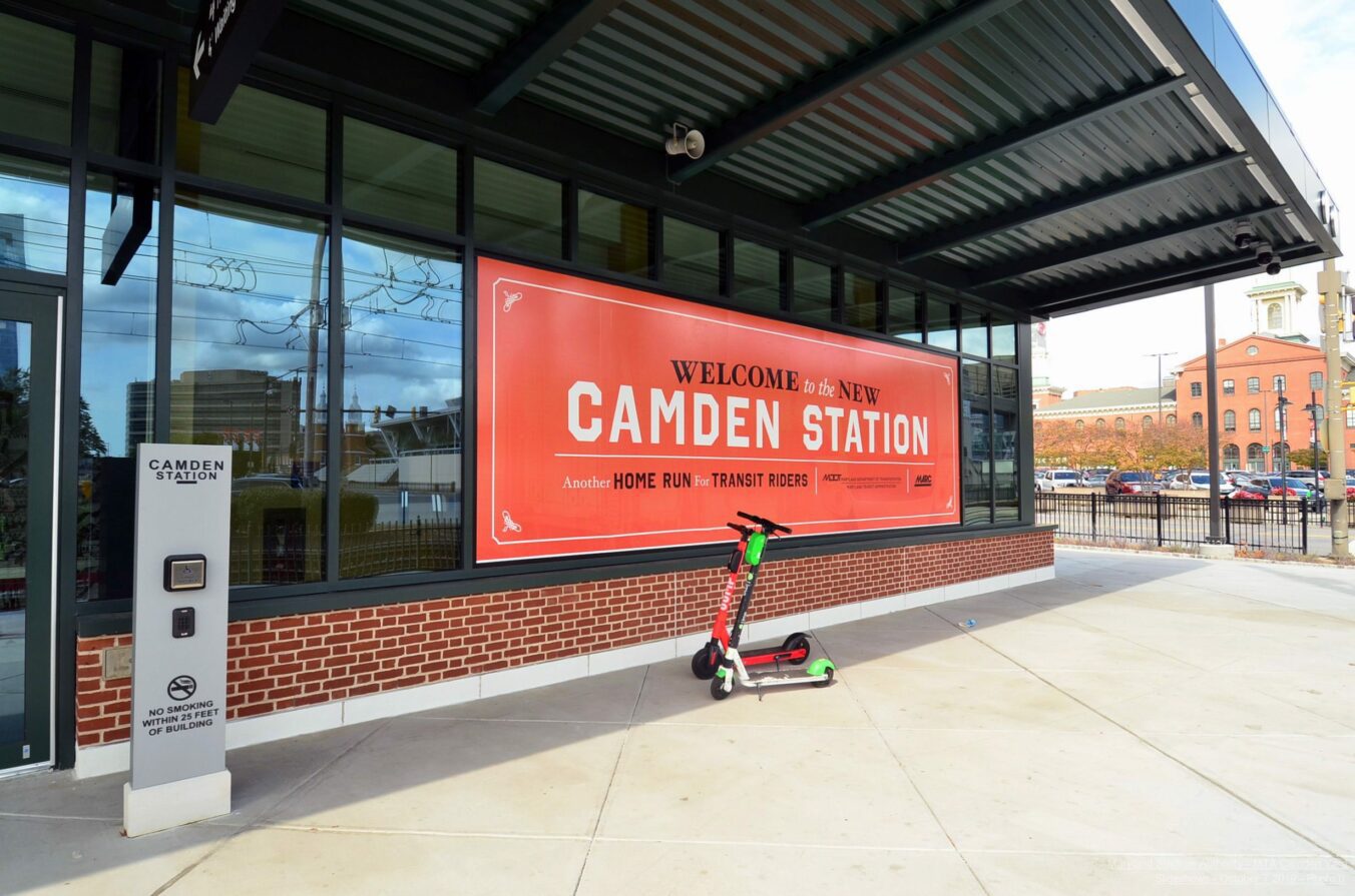 Scooters parked near the pedestrian entrance to Camden Station