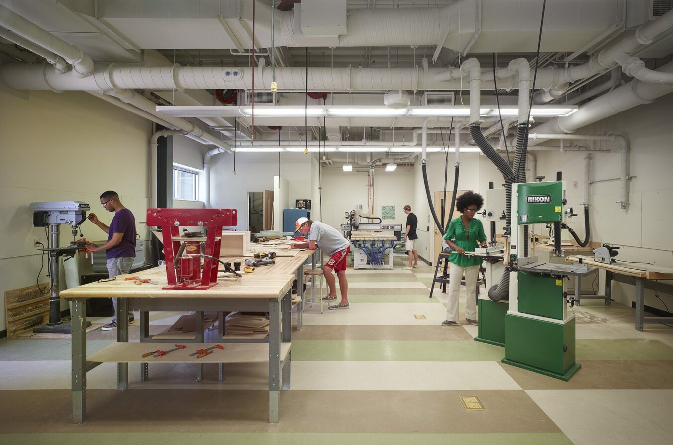 Four students working in the new model shop