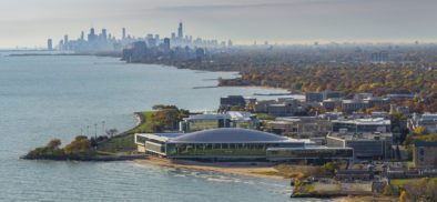 Aerial view of athletic center against Chicago skyline