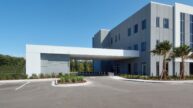 Exterior view of the covered drop off entrance to the surgery center