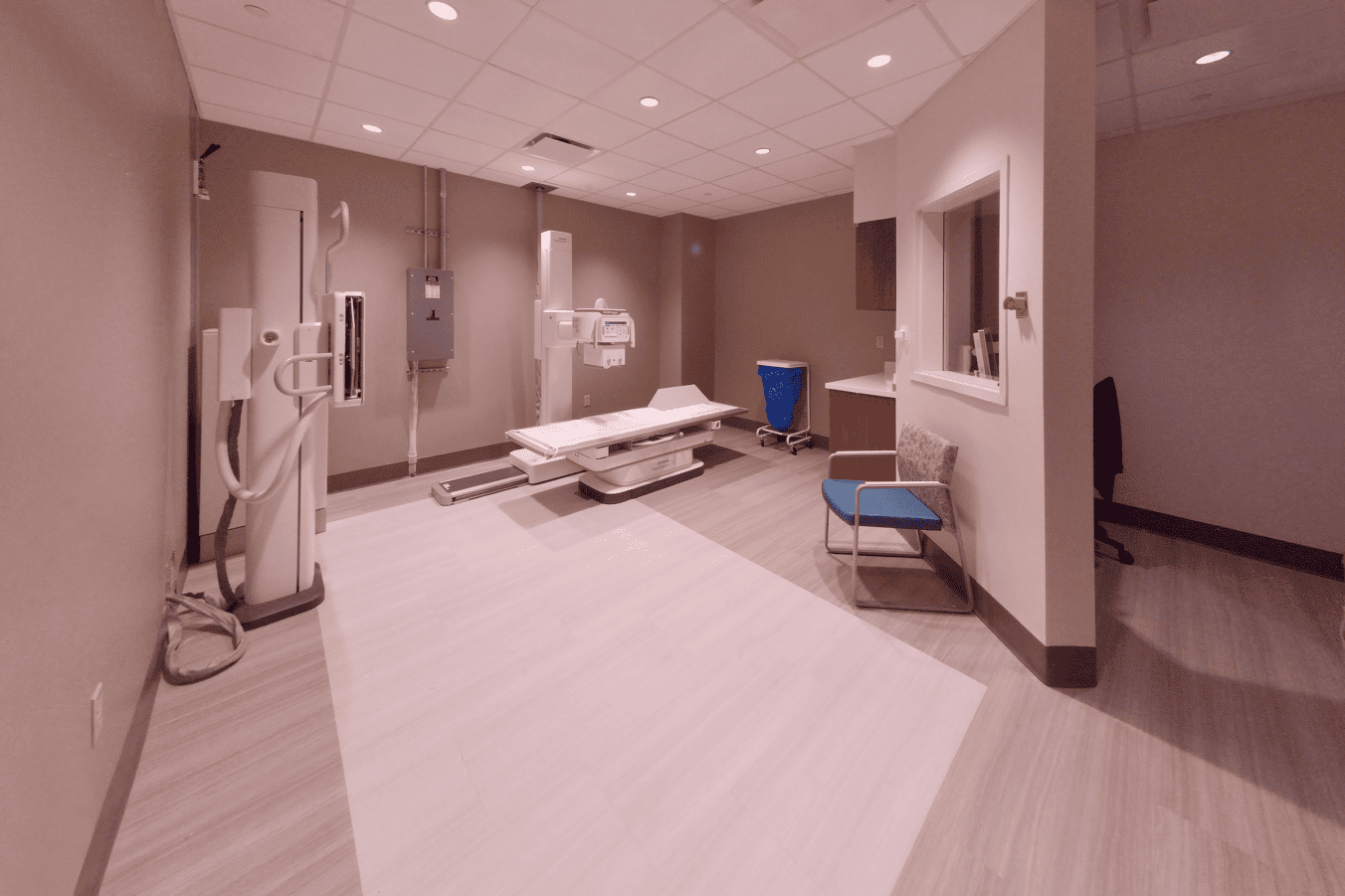 Room with x-ray machine and medical equipment