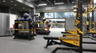 Free weights and exercise equipment in training room