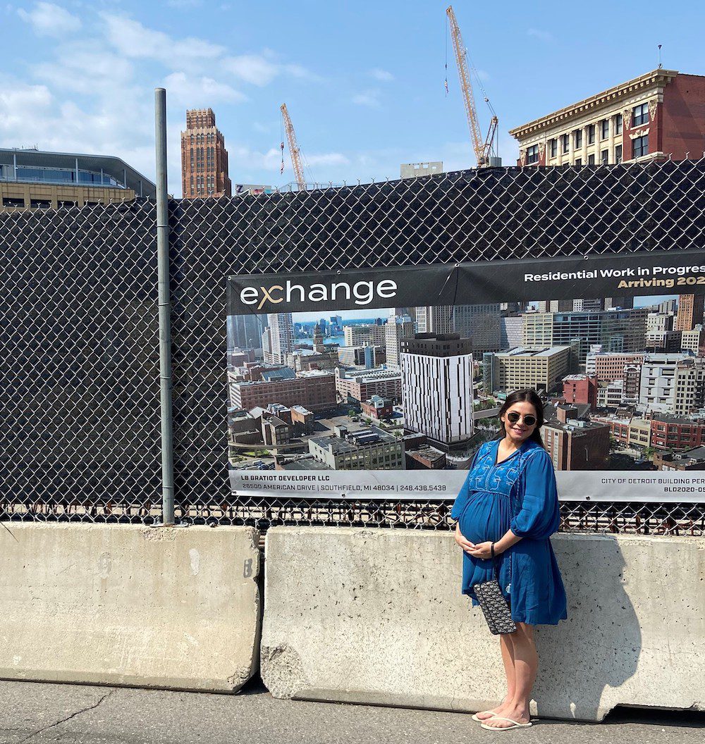 Project Engineer Bridget Joseph standing in front of the Exchange construction jobsite