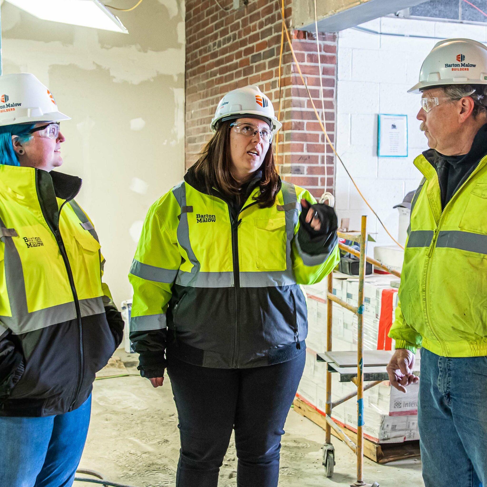 Construction Project Executive Stephanie Hachey talking with other members of the project team.