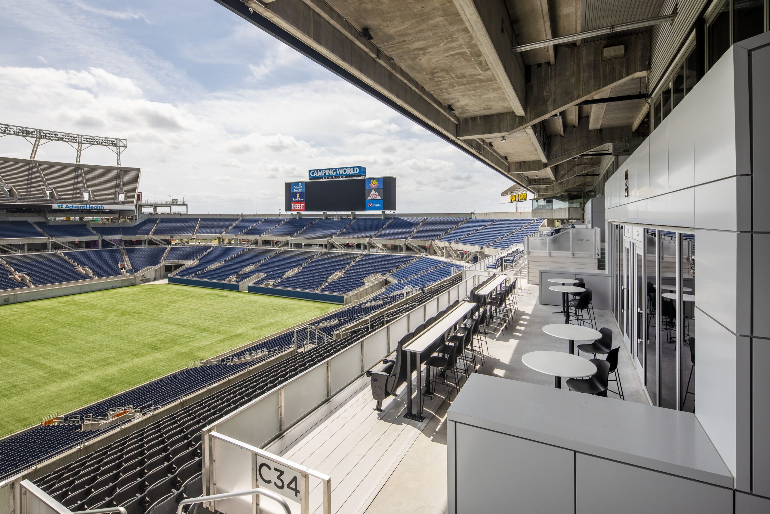 Expansive view of newly renovated Camping World Stadium featuring club seats and the lower-bowl